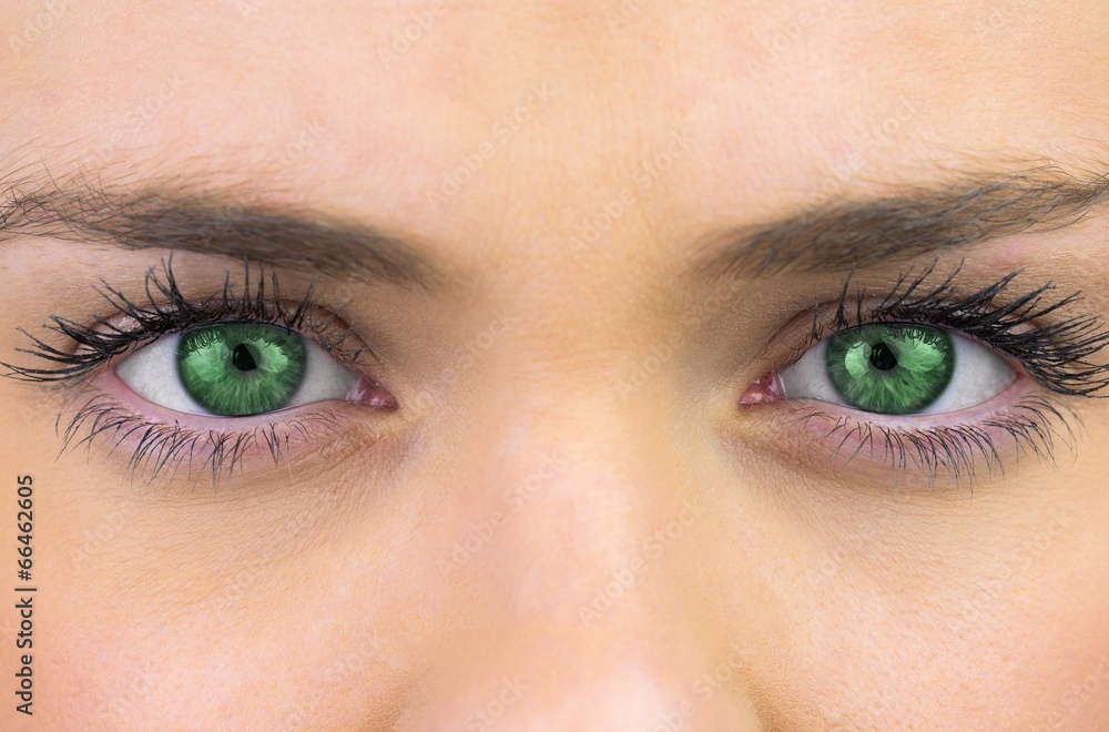 Obraz premium Bright green eyes on pretty female face