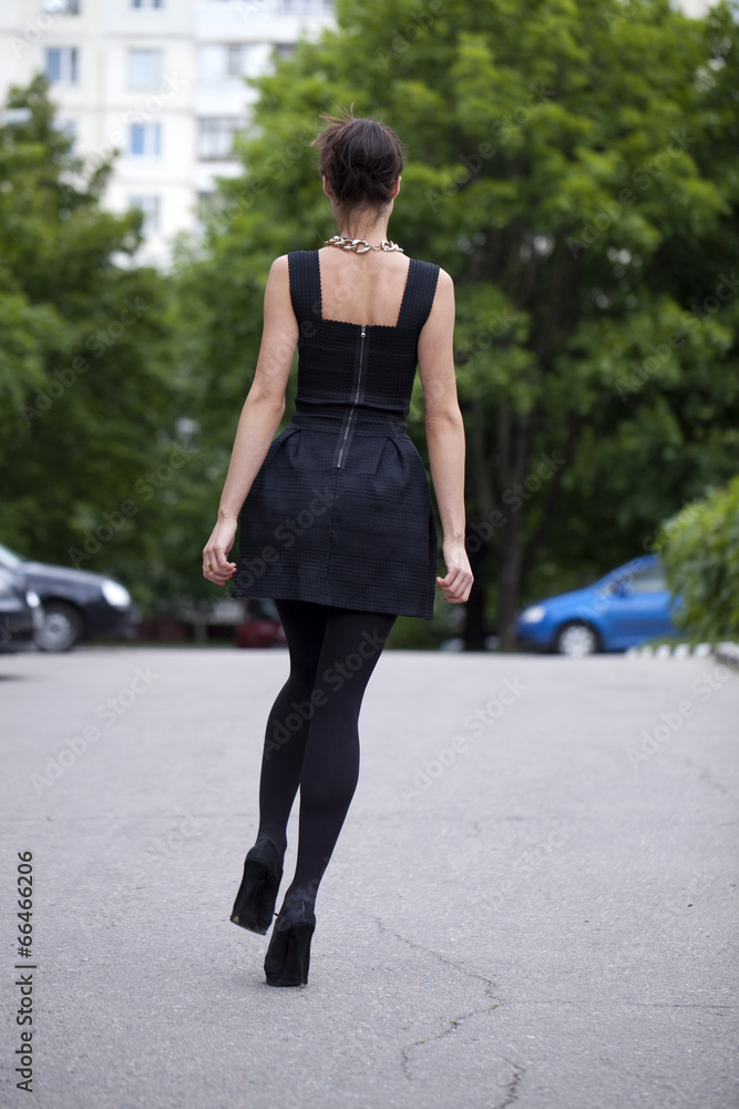 Lady in black dress in summer street Lady in black dress in summer street