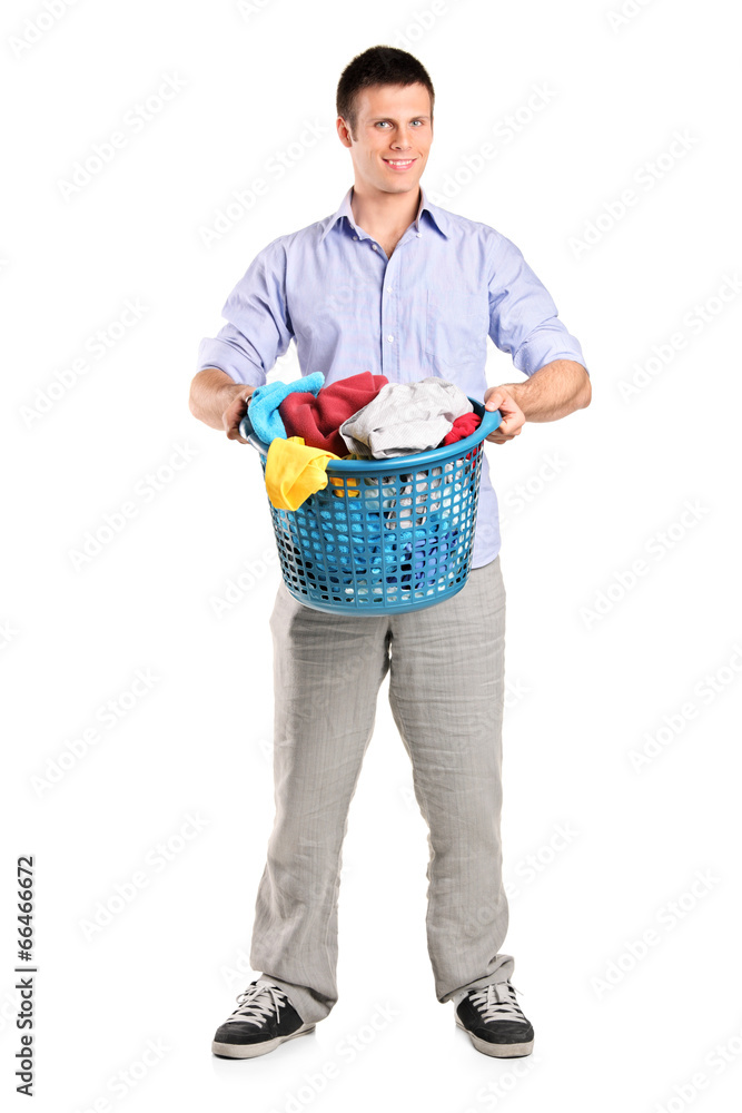 Man holding a basket full of laundry Man holding a basket full of laundry
