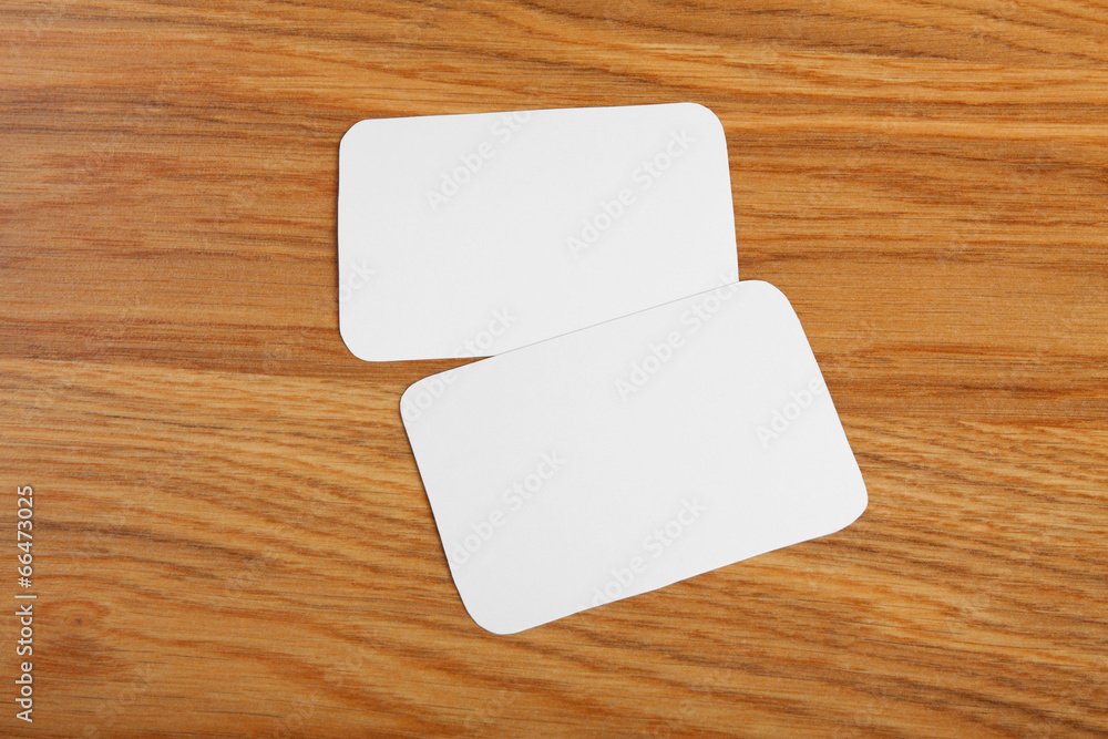blank business cards with rounded corners on a wooden background blank business cards with rounded corners on a wooden background