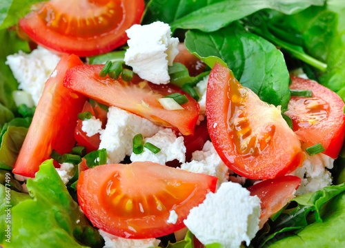 Tomato salad with cheese and arugula