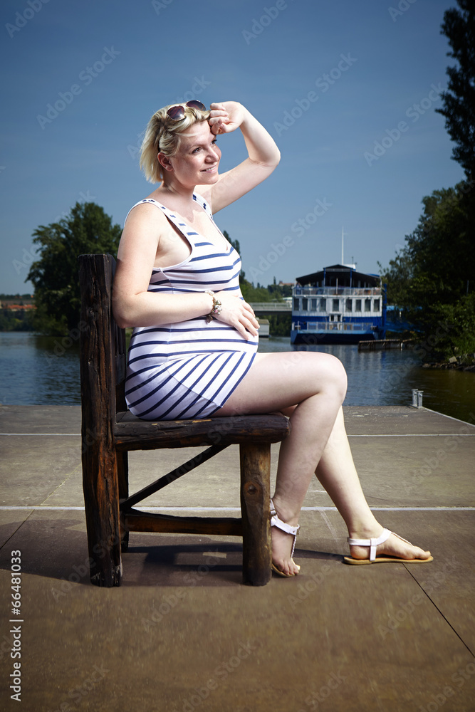 Nice pregnant lady relaxing outdoor