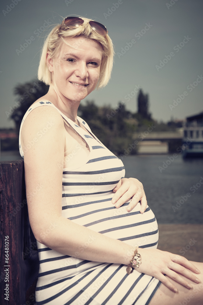 Fototapeta premium Pretty pregnant woman in sailor style