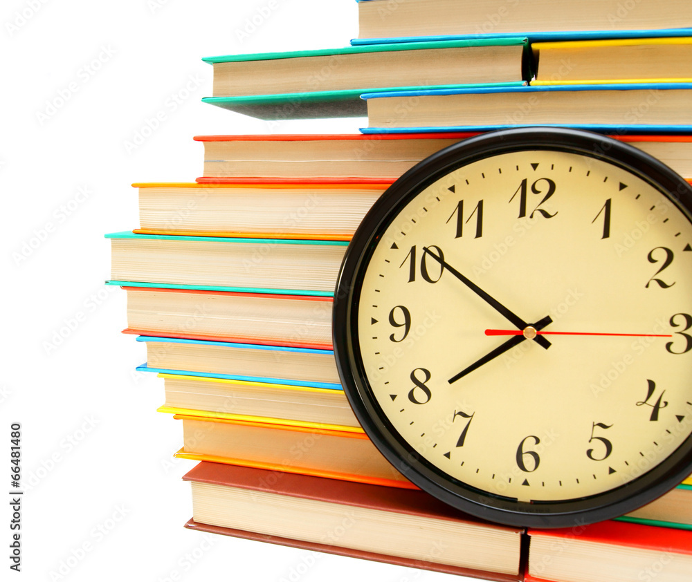 Watch and many multi-coloured books Watch and many multi-coloured books