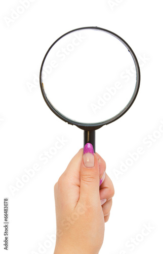 Magnifier in a hand.