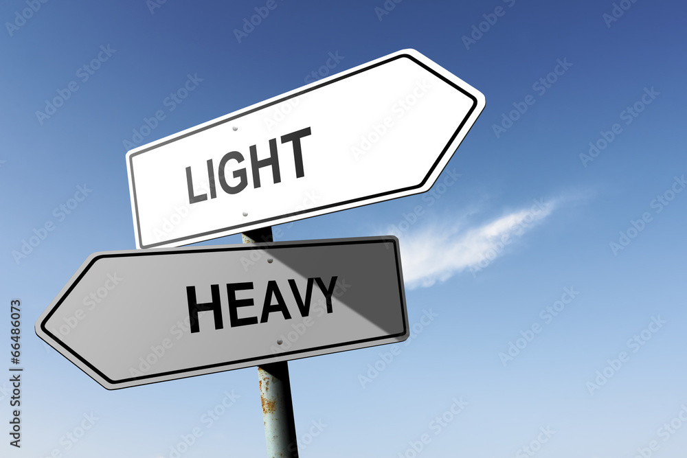Light and Heavy directions. Opposite traffic sign. Light and Heavy directions. Opposite traffic sign.