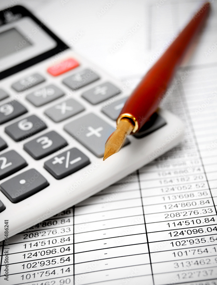 Calculator and pen on documents. Calculator and pen on documents.