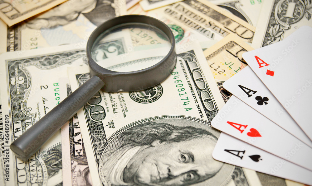 Magnifiers and game cards on dollars. Magnifiers and game cards on dollars.
