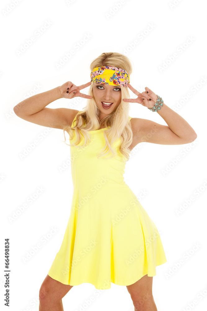 woman yellow dress headband stand two peace signs woman yellow dress headband stand two peace signs