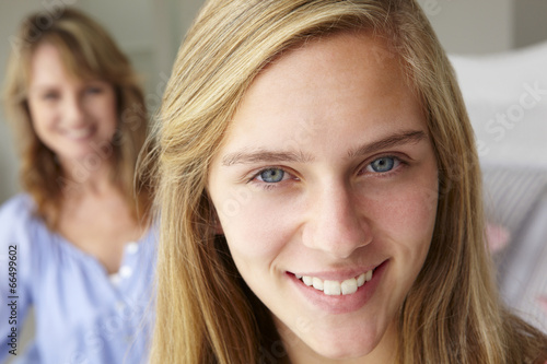 Happy teenage girl with mother