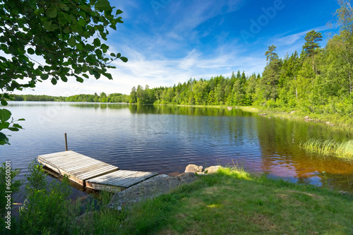 Summer Swedish lake in morning light photo