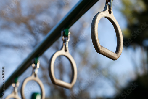 Horizontal shot of swinging rings in a playground