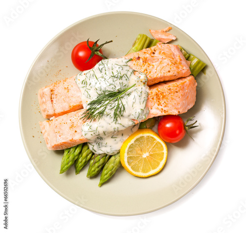 Salmon with steamed asparagus isolated