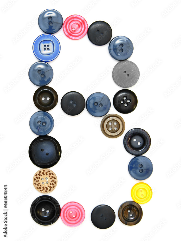 The alphabet from buttons for sewing. The alphabet from buttons for sewing.