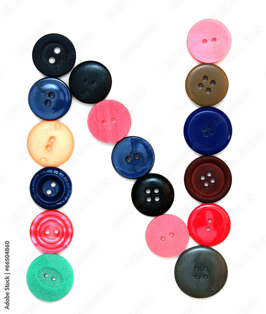The alphabet from buttons for sewing. The alphabet from buttons for sewing.
