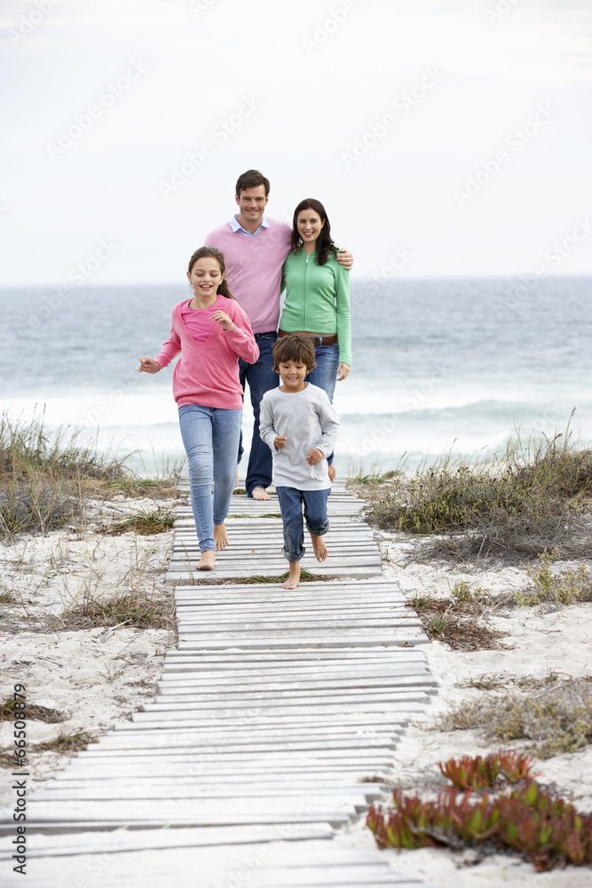 Family walking by the sea