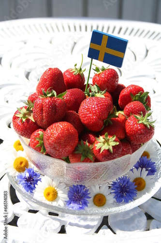 Sweet strawberries for Midsummer with Swedish flag on the top