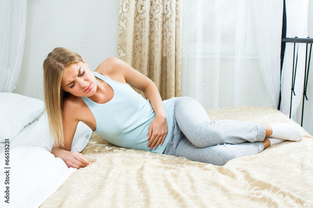 Young woman having pain in stomach Young woman having pain in stomach