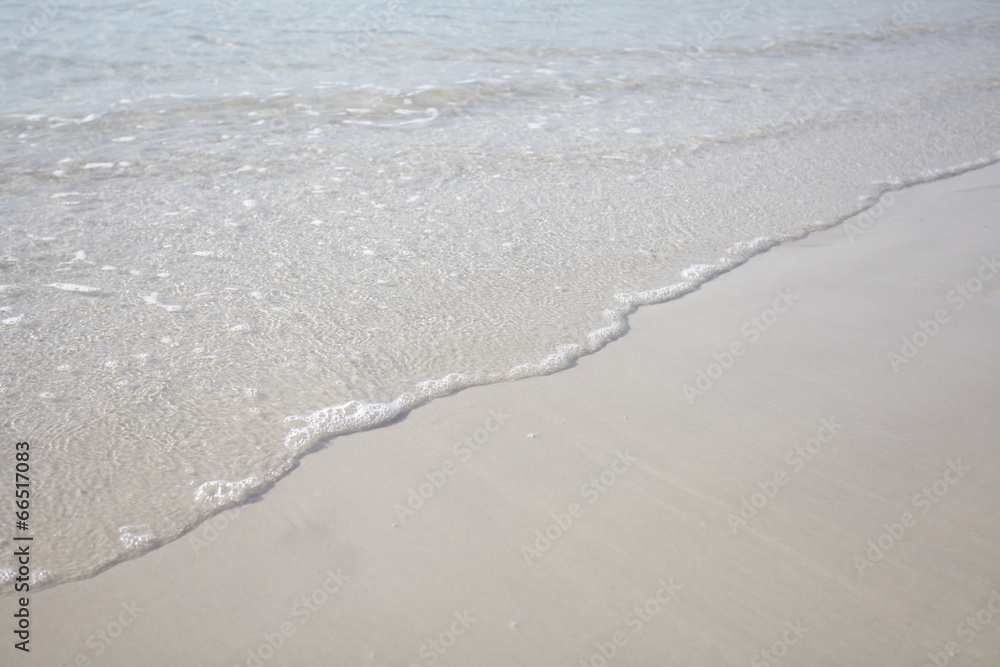 Wave of the sea on the sand beach