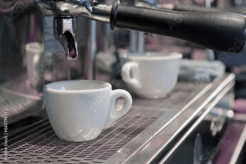 Espresso pouring into a cup