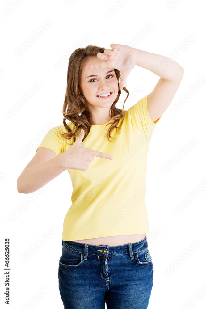 Woman is showing frame by hands. Woman is showing frame by hands.