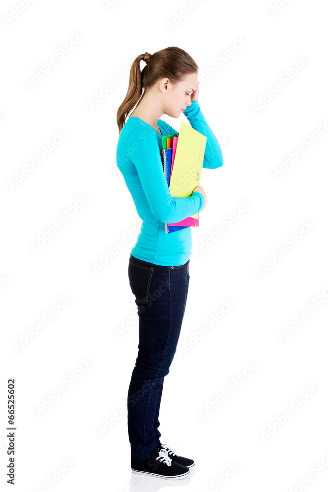 Fototapeta premium Young beautiful student woman with depression