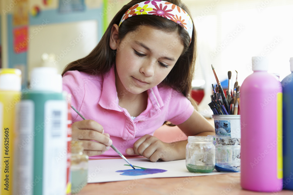 Pre teen girl in art class Stock Photo | Adobe Stock