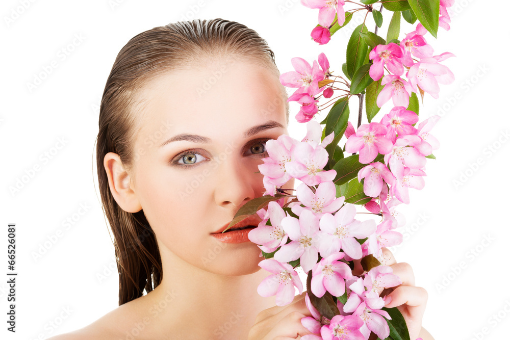 Woman with healthy clean skin and pink flowers Woman with healthy clean skin and pink flowers