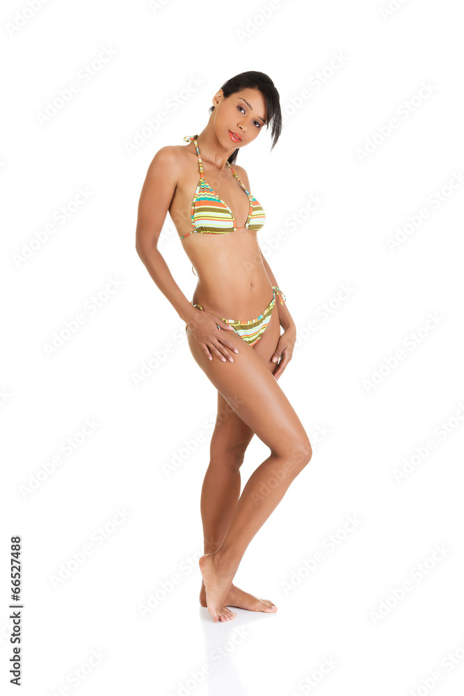 Fototapeta premium Tanned fit woman in bikini