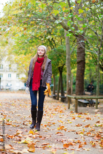 Beautiful young girl walking on a fall day