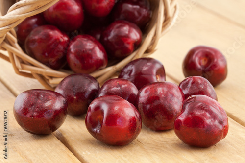 Basket with red ripe cherries