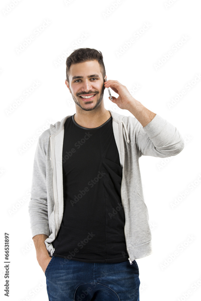 Young man talking on cell phone Young man talking on cell phone