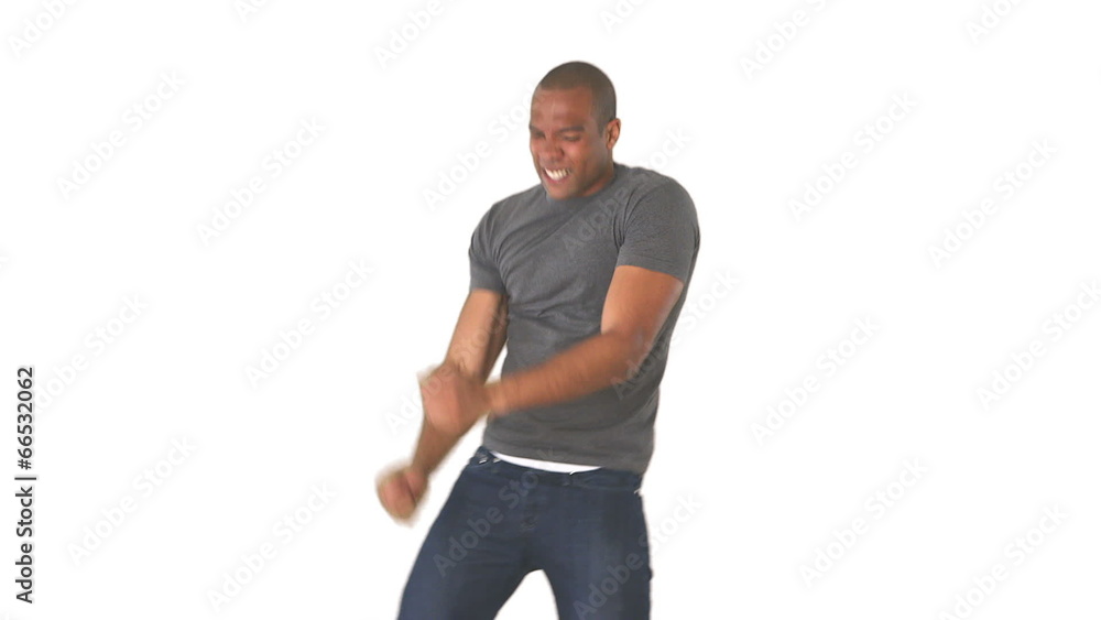 Young man in jeans and t-shirt dancing Young man in jeans and t-shirt dancing
