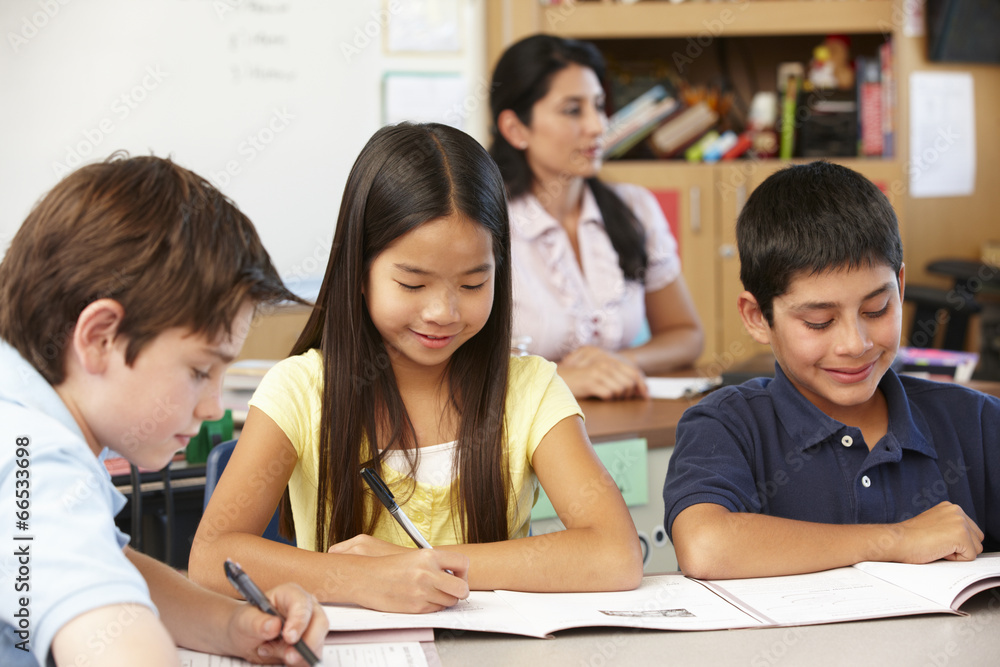 Teacher and schoolchildren in class Teacher and schoolchildren in class