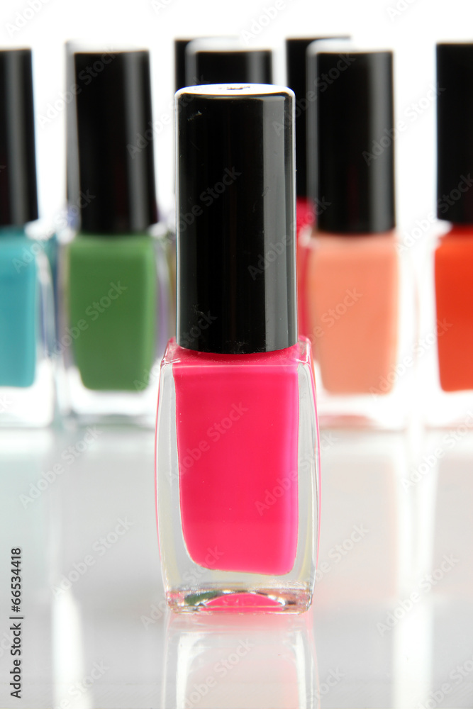 Group of bright nail polishes isolated on white Group of bright nail polishes isolated on white