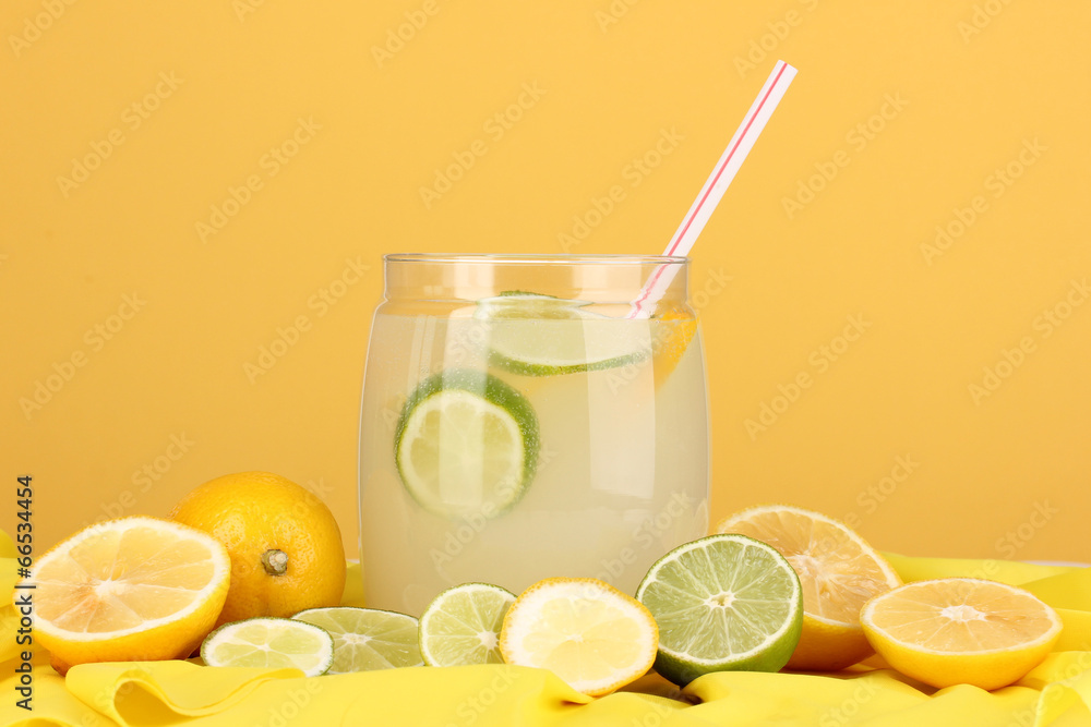 Citrus lemonade in glass bank of citrus around Citrus lemonade in glass bank of citrus around