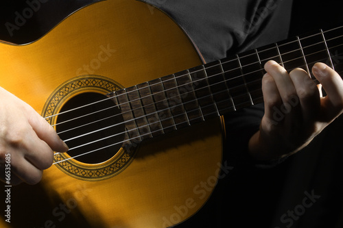 Acoustic guitar hands close up