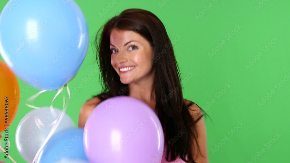 Closeup of young woman playing with balloons Closeup of young woman playing with balloons