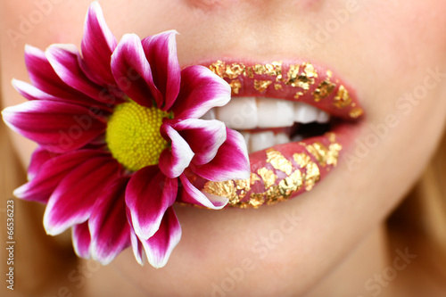 Beautiful flower in teeth  close up