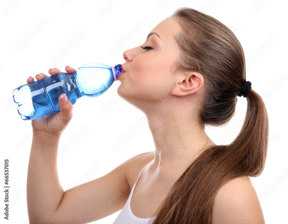 Beautiful girl drinks water, isolated on white Beautiful girl drinks water, isolated on white