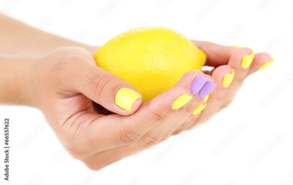 Female hands with stylish colorful nails holding fresh lemon, Female hands with stylish colorful nails holding fresh lemon,