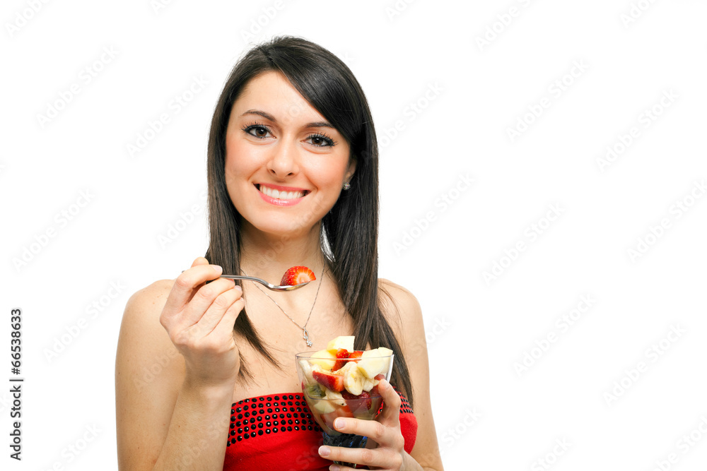 Woman eating a fruit cocktail Woman eating a fruit cocktail