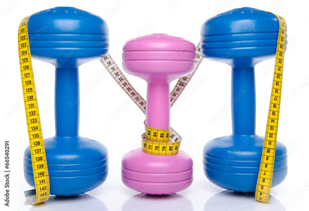 Pink and blue dumbells with a tape measure