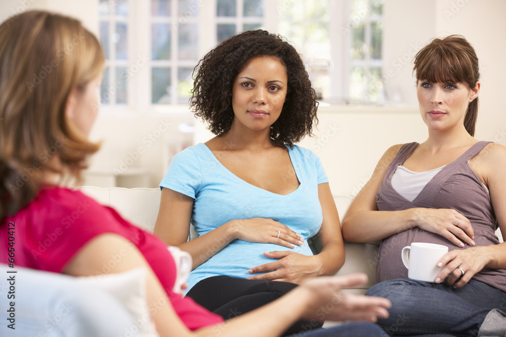 Pregnant women relaxing together Pregnant women relaxing together