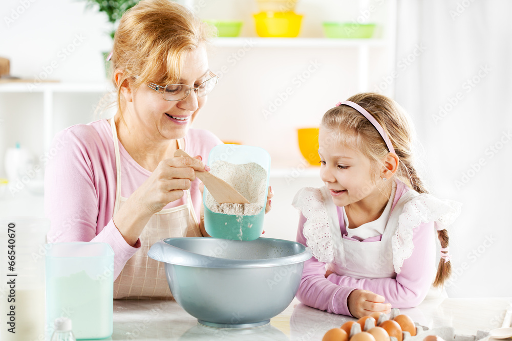 Grandmother and granddaughter making Dough Grandmother and granddaughter making Dough