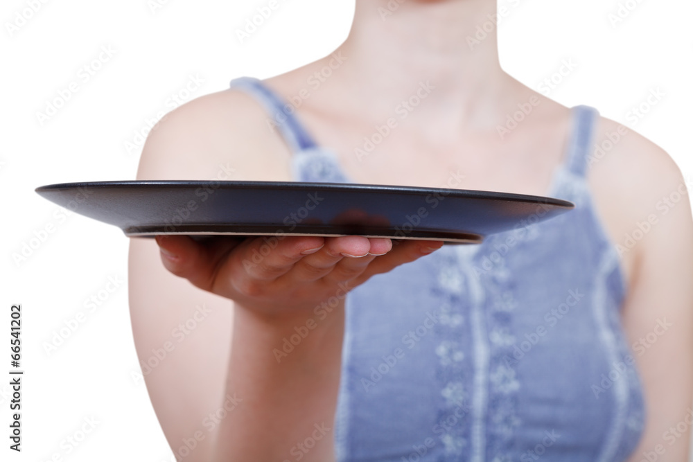 woman holds empty black plate on hand woman holds empty black plate on hand