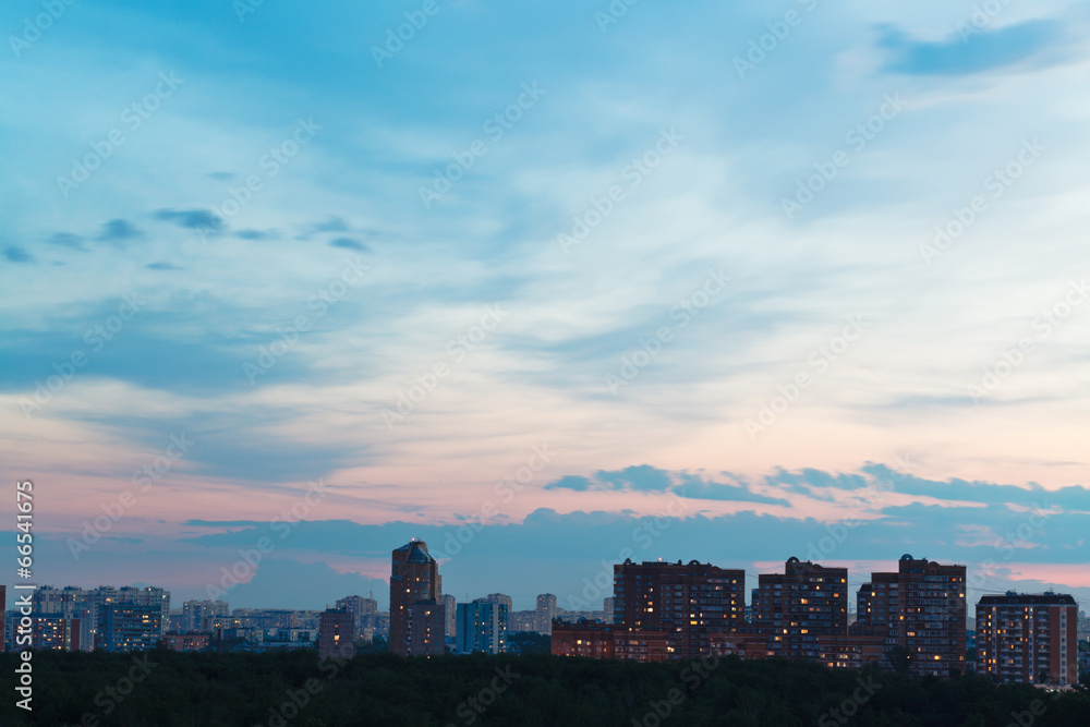 durk blue and pink night sky over city