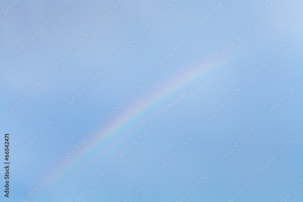 rainbow in blue sky