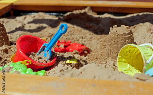 Pit sand with plastic toys