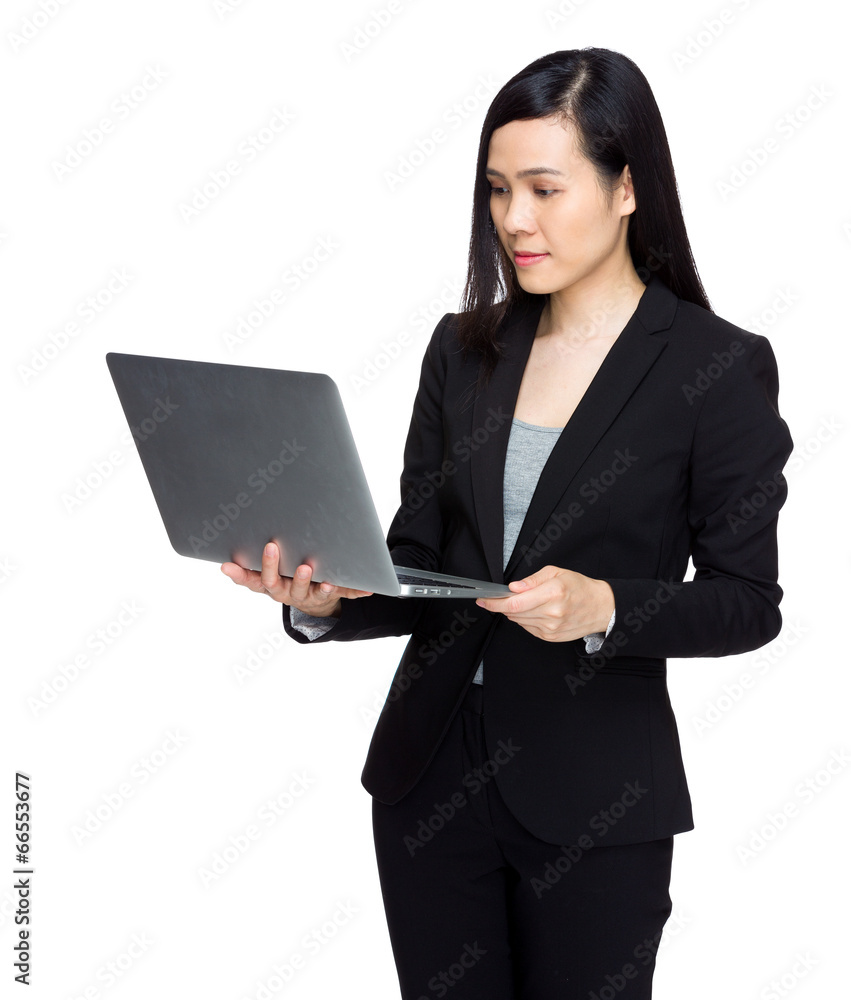 Business secretary look at laptop computer Business secretary look at laptop computer